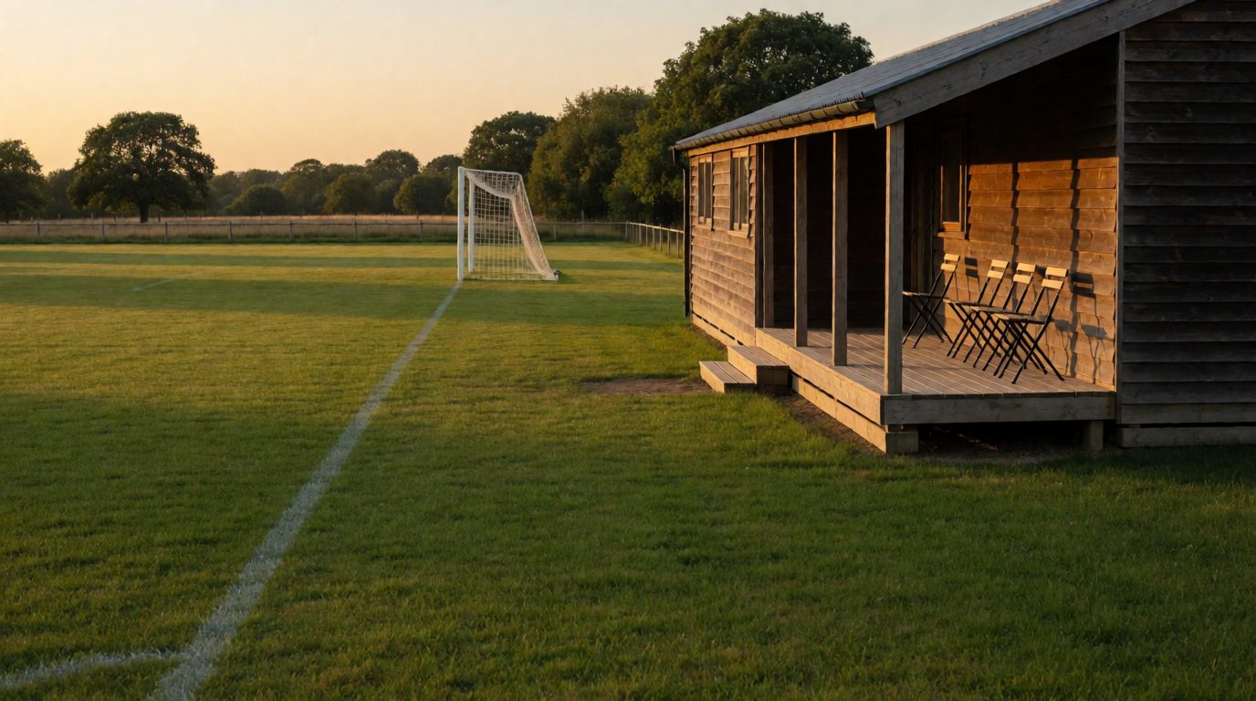 The TSV Moorbek pitch with the clubhouse in evening light