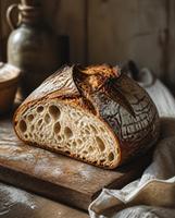 freshly sliced sourdough bread, warm morning light, flour dust